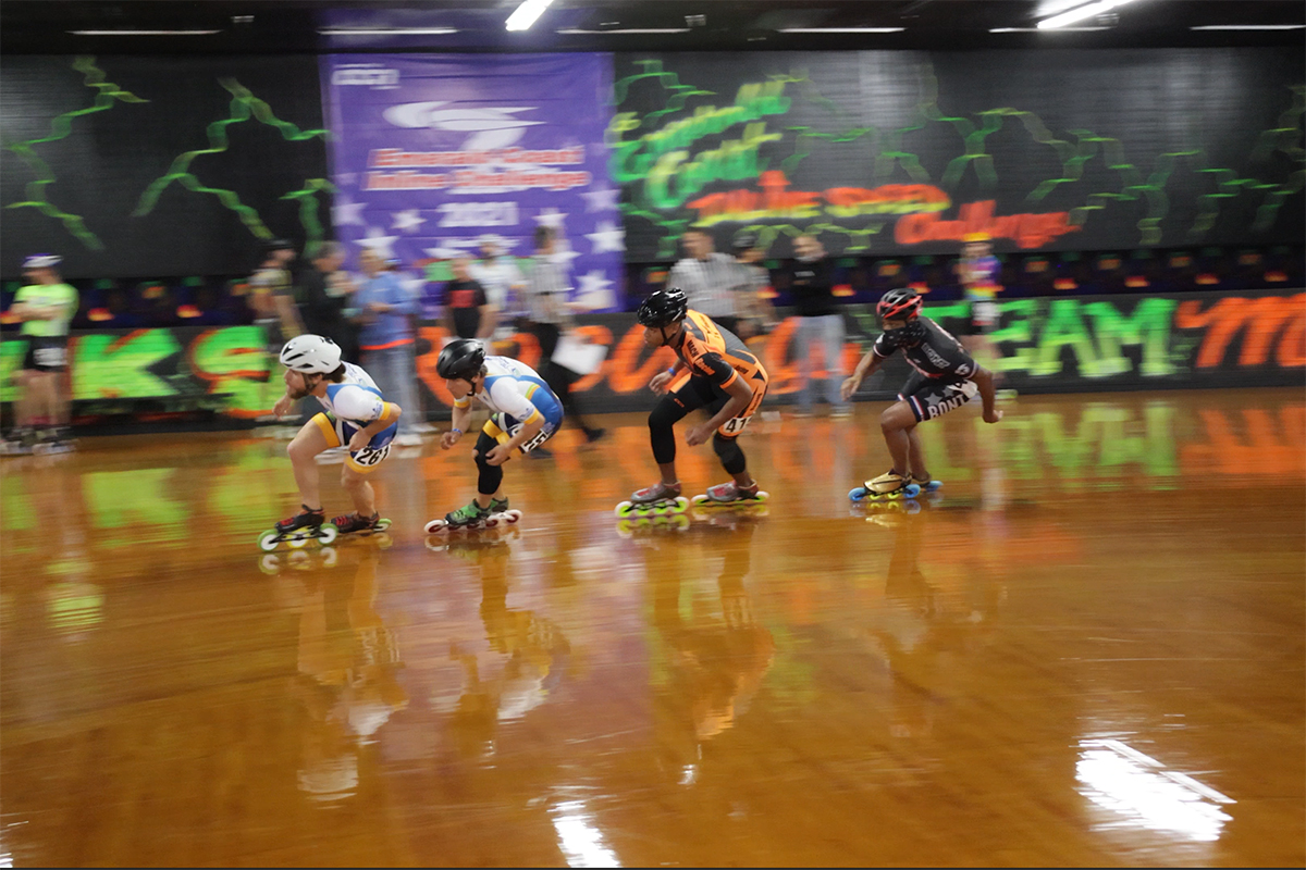 Awesome Speed Skater Avoids Bad Crash In Indoor Inline Skating Race In